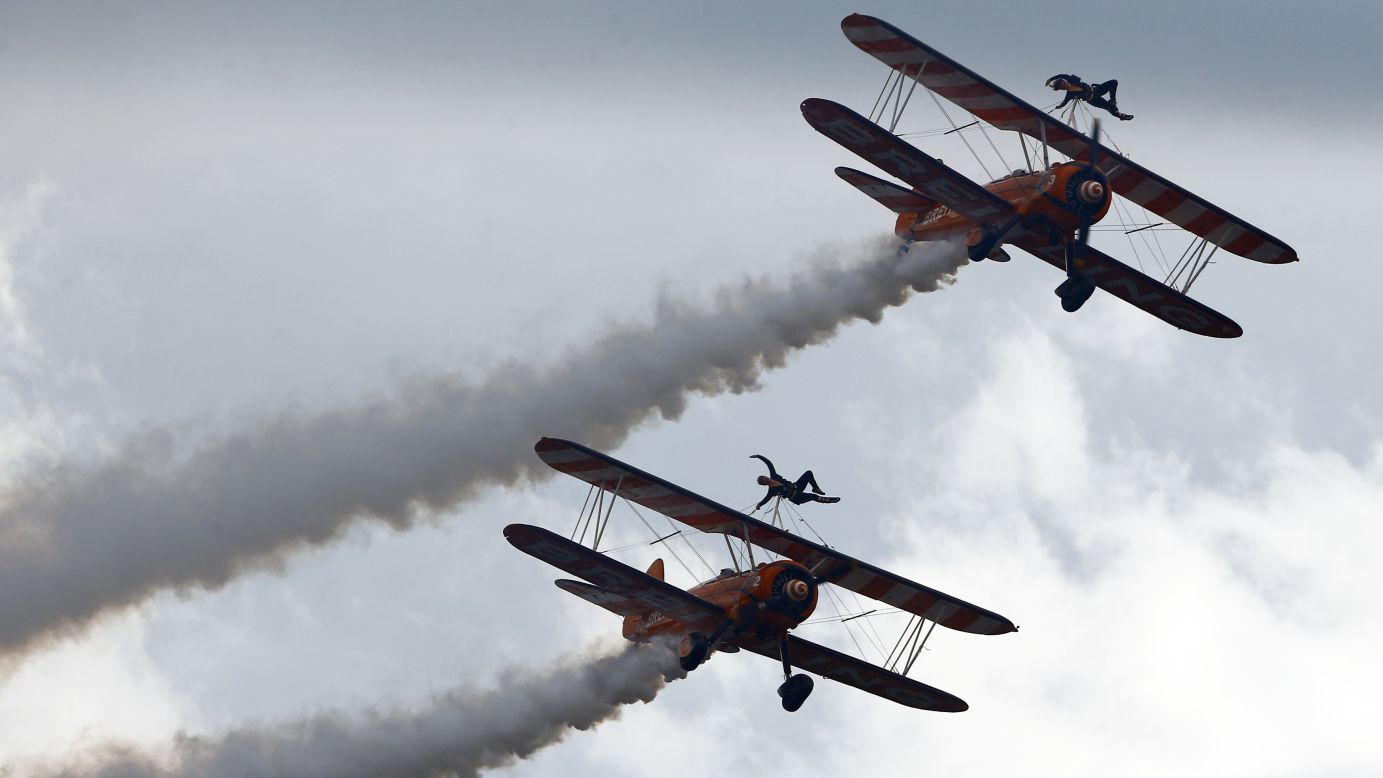 Members of the Breitling Wingwalkers perform during the Air14 air show Sunday, August 31, in Payerne, Switzerland.