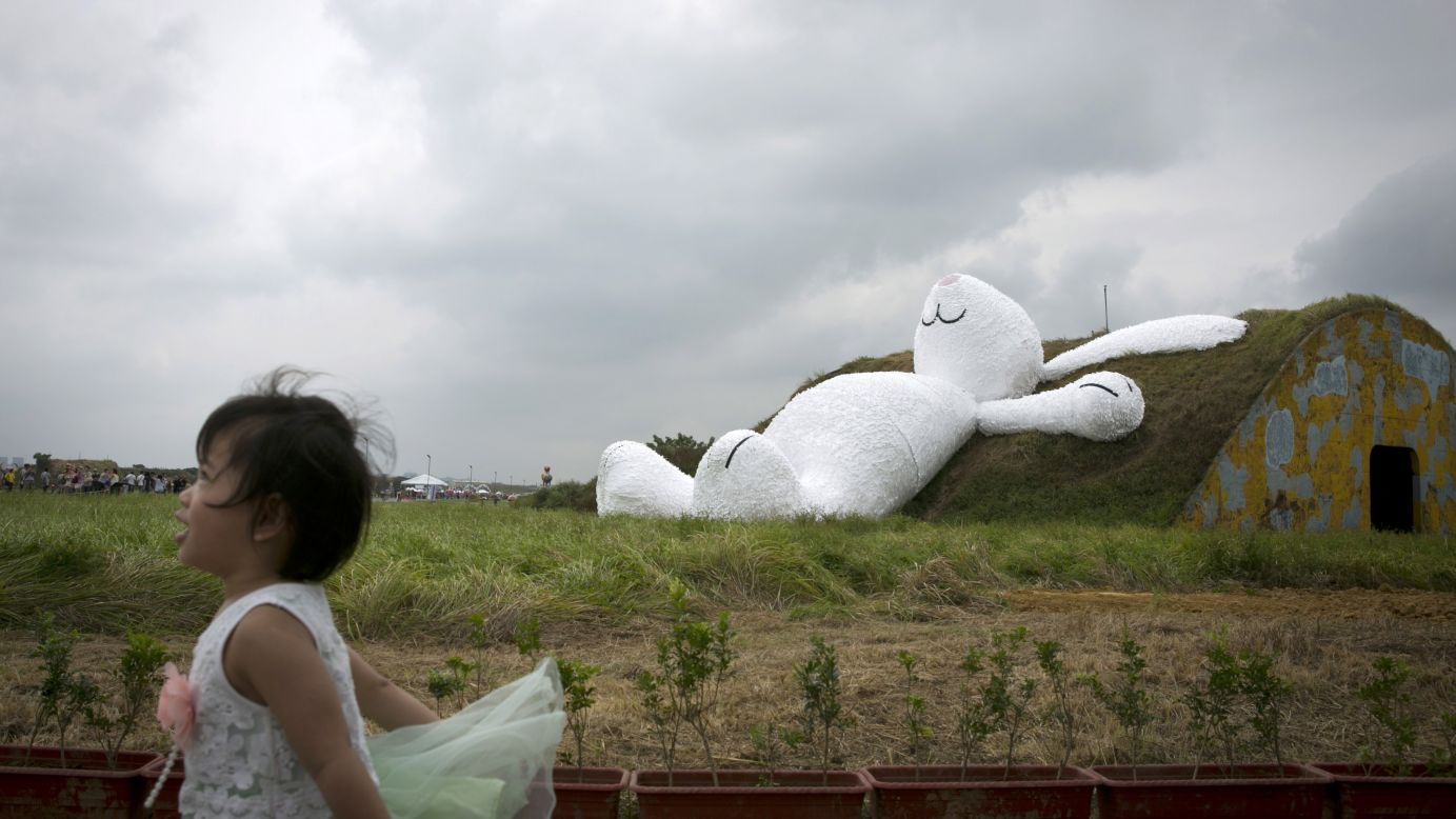 An 82-foot white rabbit, created by Dutch artist Florentijn Hofman, sits in Taipei, Taiwan, on Thursday, September 4. The rabbit is part of the Taoyuan Land Art Festival at Taoyuan Naval Base.