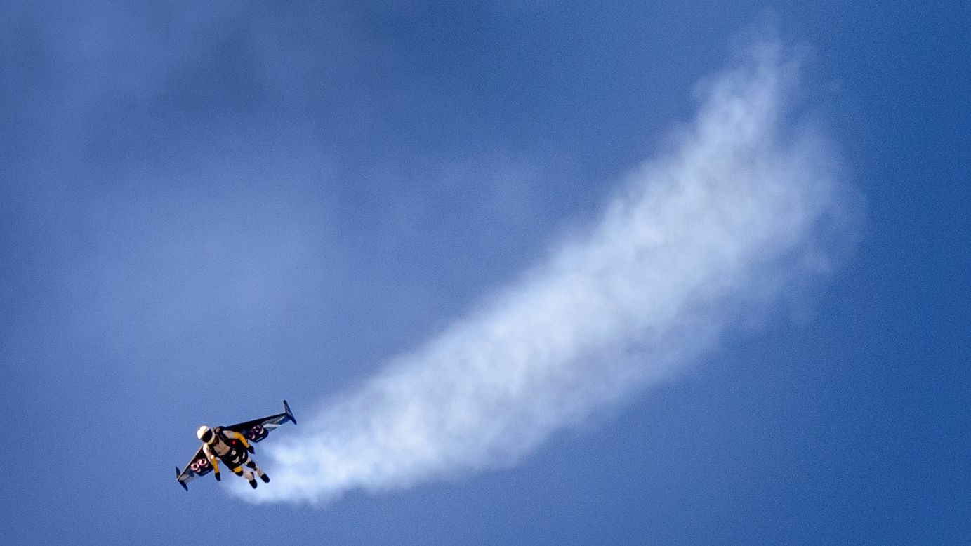 Swiss pilot Yves Rossy flies with jet-powered wings attached to his back Sunday, August 31, during the Air14 air show in Payerne, Switzerland.