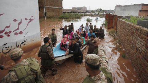 Pakistani soldiers rescue residents from a flooded area on the outskirts of Islamabad on September 5.