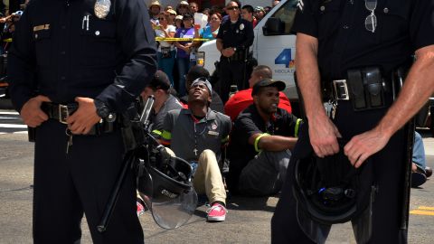 People stage a sit-in before being detained by police outside a McDonald's in Los Angeles on Thursday, September 4.<a href="http://money.cnn.com/2014/09/01/news/companies/fast-food-worker-strike/"> Fast-food workers protested in more than 150 U.S. cities</a> as they called for a mininum wage of $15 an hour and the right to form a union without retaliation.