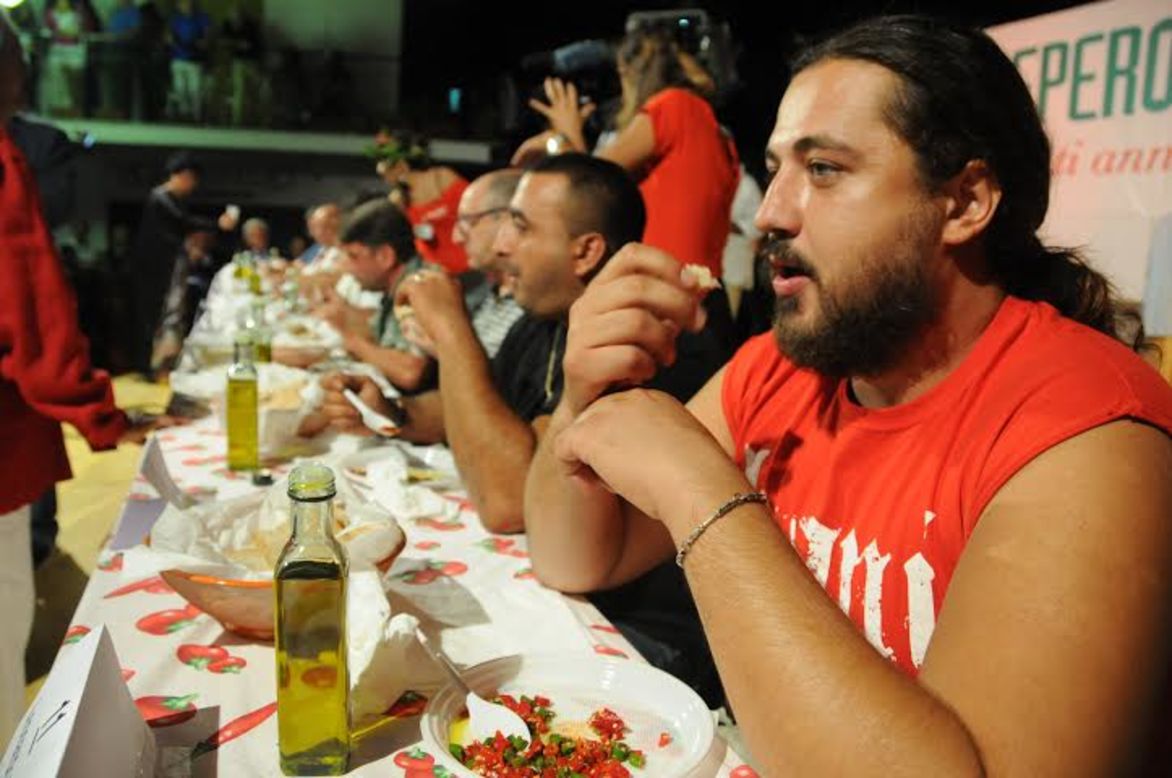 "It's nasty but it's also fun to watch other people stuffing their mouths, turning red and suffering like hell," says Chilli festival organizer Enzo Monaco.