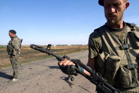 A pro-Russian rebel holds a destroyed weapon in the village of Novokaterynivka, Ukraine, on Thursday, September 4.