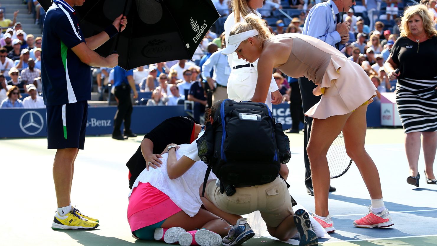 Caroline Wozniacki consoles Peng Shuai, who was forced to retire in the U.S. Open semifinals Friday. 