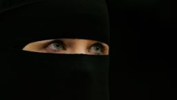 A woman wearing a niqab veil listens during a seminar organised by the women's chapter of Hizb-ut-Tahrir Britain, to challenge the remarks made by Jack Straw and other British ministers against the veil on October 14, 2006 in London, England. 