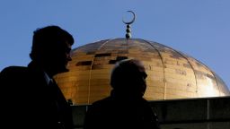 People leave Regent's Park Mosque after prayers were held ahead of a private funeral for the poisoned former Russian KGB spy Alexander Litvinenko on December 7, 2006 in London, England.