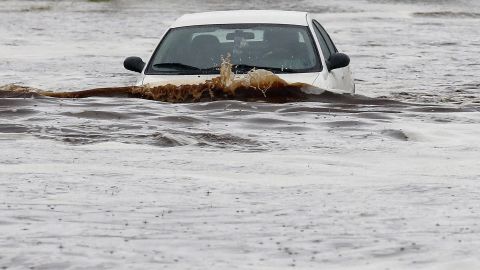 A driver tries to navigate a severely flooded street in Phoenix on September 8. 