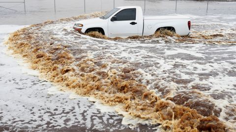 A truck creates a wake as its driver tries to make it through a severely flooded street in Phoenix on Monday, September 8. Arizona's governor declared a statewide emergency as <a href="http://www.cnn.com/2014/09/08/us/arizona-flooding/index.html">record-setting rains flooded numerous Phoenix-area roadways and forced some schools to shut down.</a>