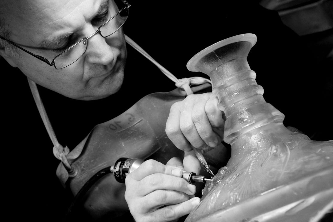 A Lalique master craftsman working on The Macallan 64 year old, auctioned for $460,000