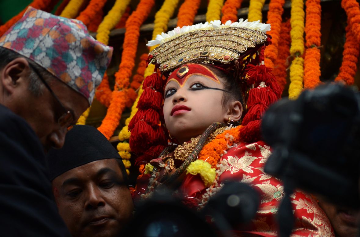 SEPTEMBER 9 - KATHMANDU, NEPAL: A Nepalese child revered as a living goddess, or Kumari, is carried on a palanquin during a procession on the main day of the Indra Jatra festival at Basantapur Durbar Square on September 8. Nepal's week-long festival celebrates "Indra," the king of gods and the god of rains.