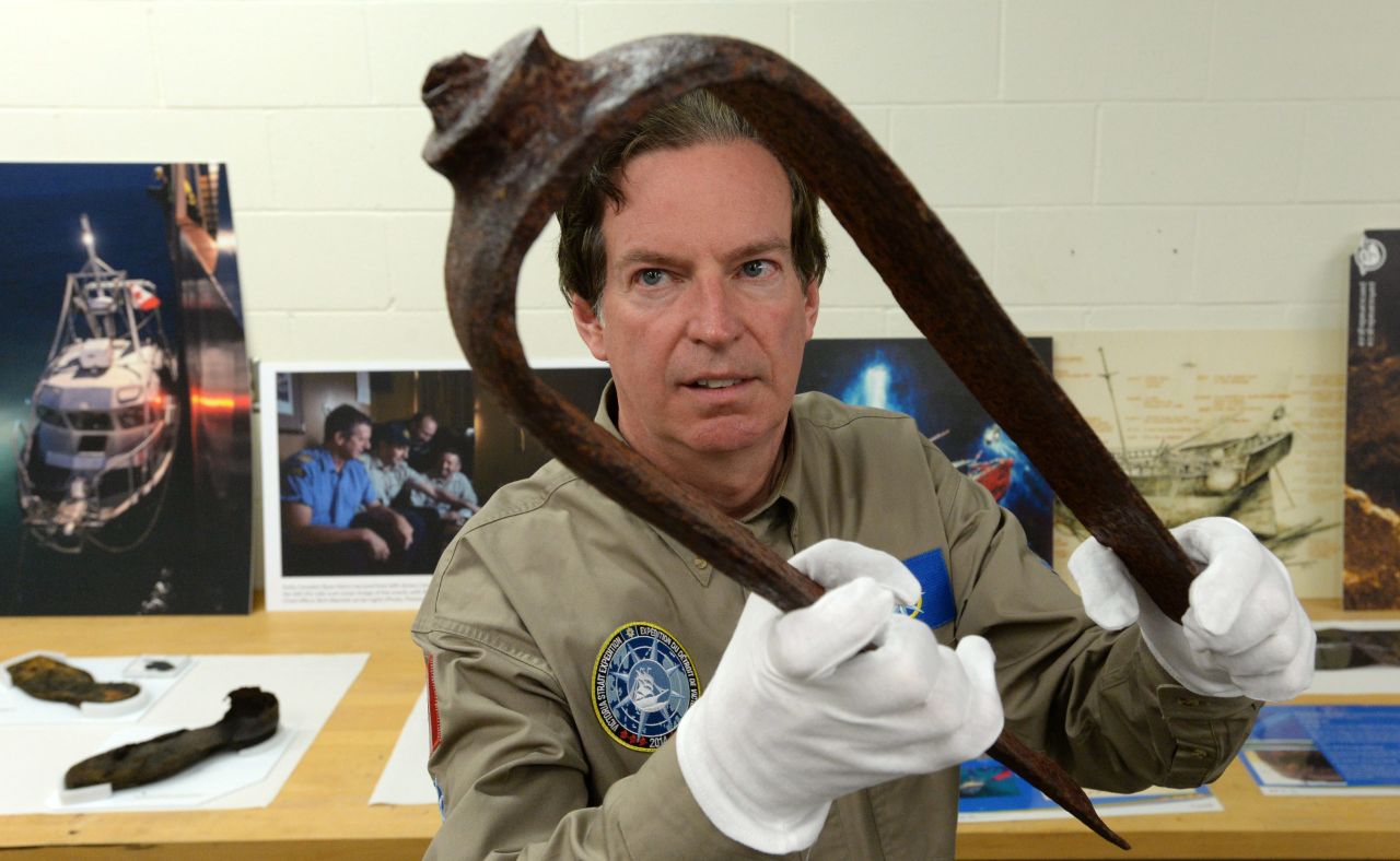 This iron fitting held by John Geiger, president of the Royal Canadian Geographical Society, is a key piece of evidence that led to the discovery of the missing ship. 