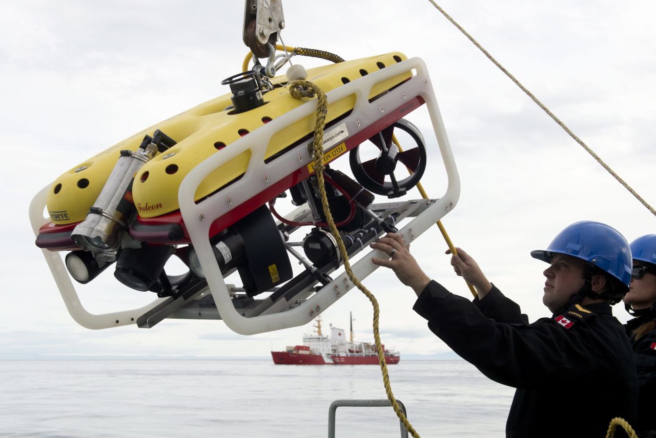 A crew member of the HMCS Kingston loads an remote underwater vehicle, part of the Victoria Strait Expedition, as seen in an August 24 photo.