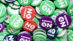 Pro-union "No" pin badges are displayed on a "Better Together" campaign stall in Edinburgh on September 9, 2014, ahead of Scotland's independence referendum. With polls ahead of Scotland's independence referendum now showing the two sides neck and neck, Britain is starting to consider seriously the implications of a "Yes" victory. AFP PHOTO/LESLEY MARTINLESLEY MARTIN/AFP/Getty Images