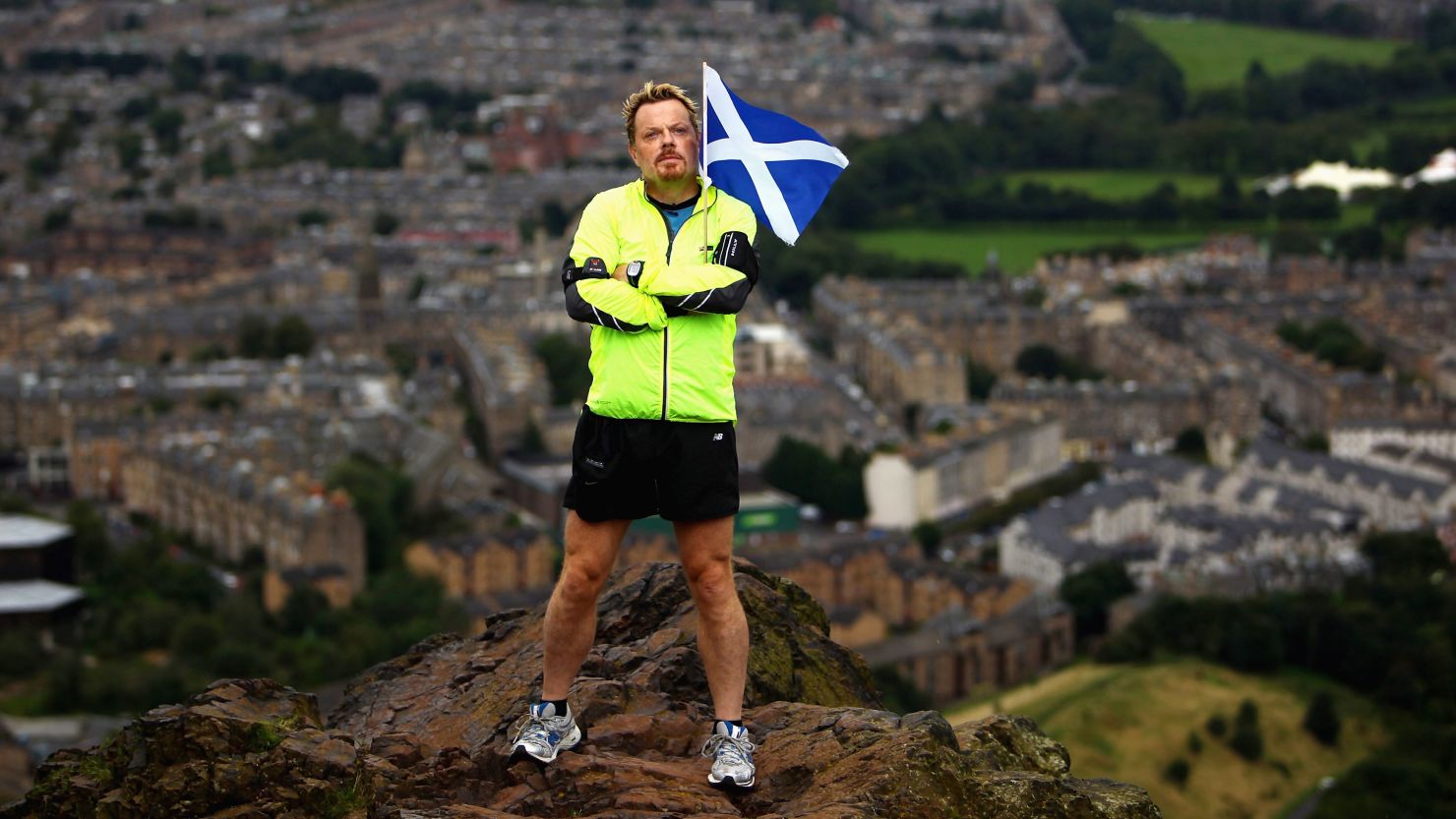 Eddie Izzard stands on the top of Arthur's Seat in Edinburgh in 2009, while running 43 marathons for Sport Relief. 