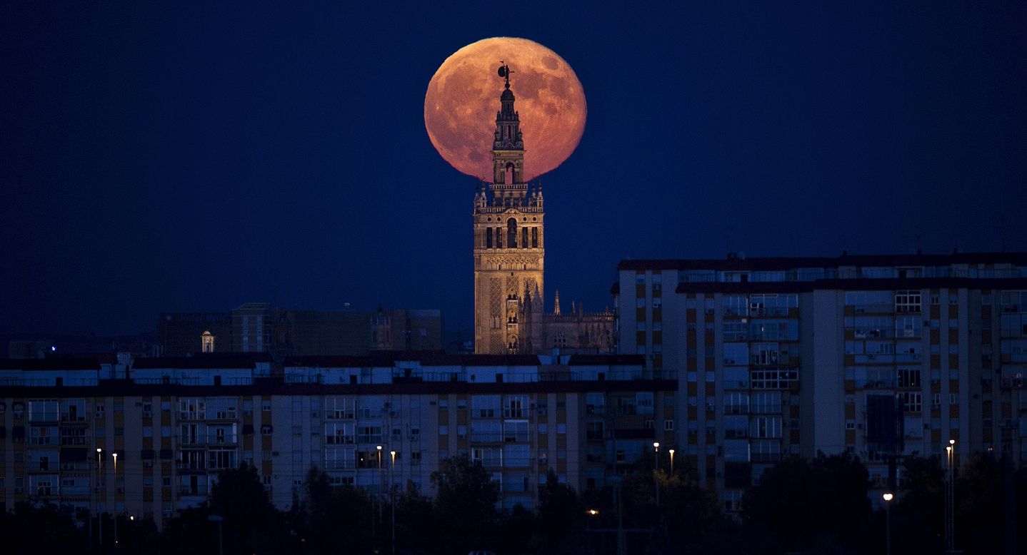 SEPTEMBER 10 - SEVILLE, SPAIN: The moon rises over the Giralda, the tower of Seville's Cathedral, on September 9. This will be the third and final "supermoon", also known as a "Harvest Moon" or a "perigee moon" by scientists, of 2014. The phenomenon occurs when the moon is near the horizon and appears larger and brighter than usual.