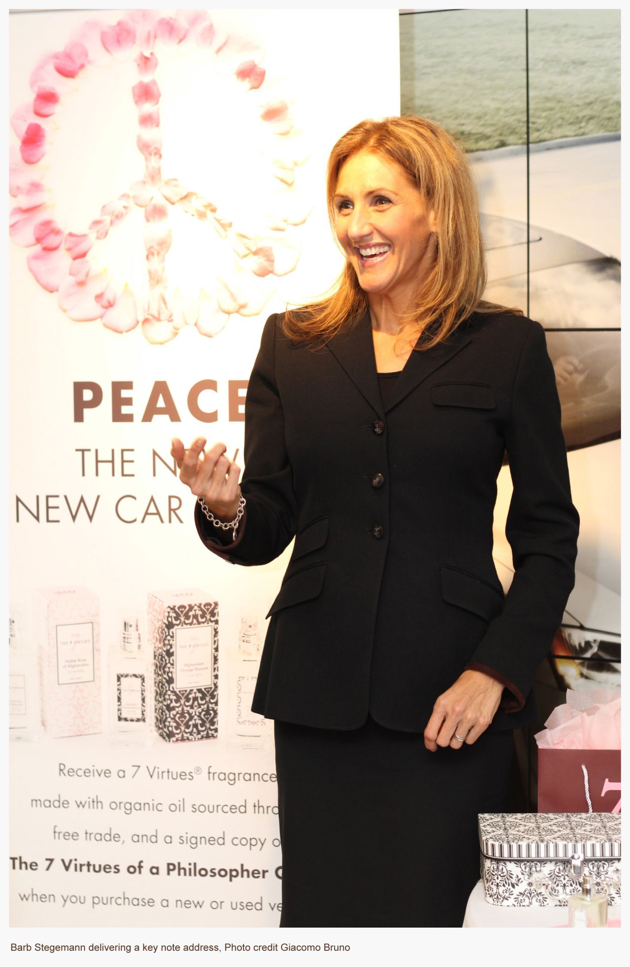 Entrepreneur Barb Stegemann speaking at a fragrance launch. She is also an author and motivational speaker. 