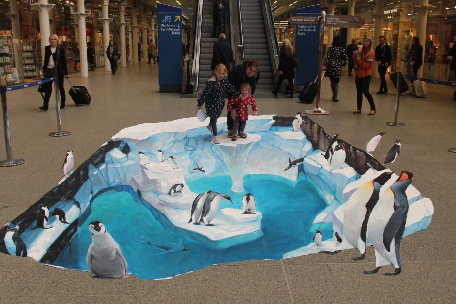 Shoppers get to take part in this 3D art in a shopping mall advertising for SeaWorld. 