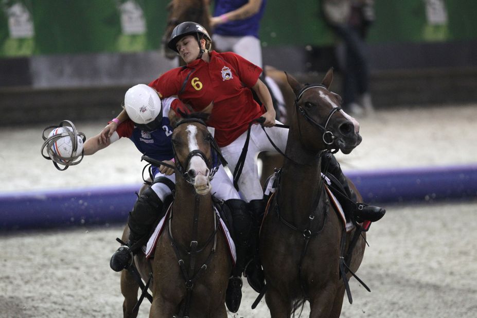 A little less graceful is the unusual sport of horse-ball. Here, France's Cecile Guerpillonand Spain's Laura Font go head-to-head.