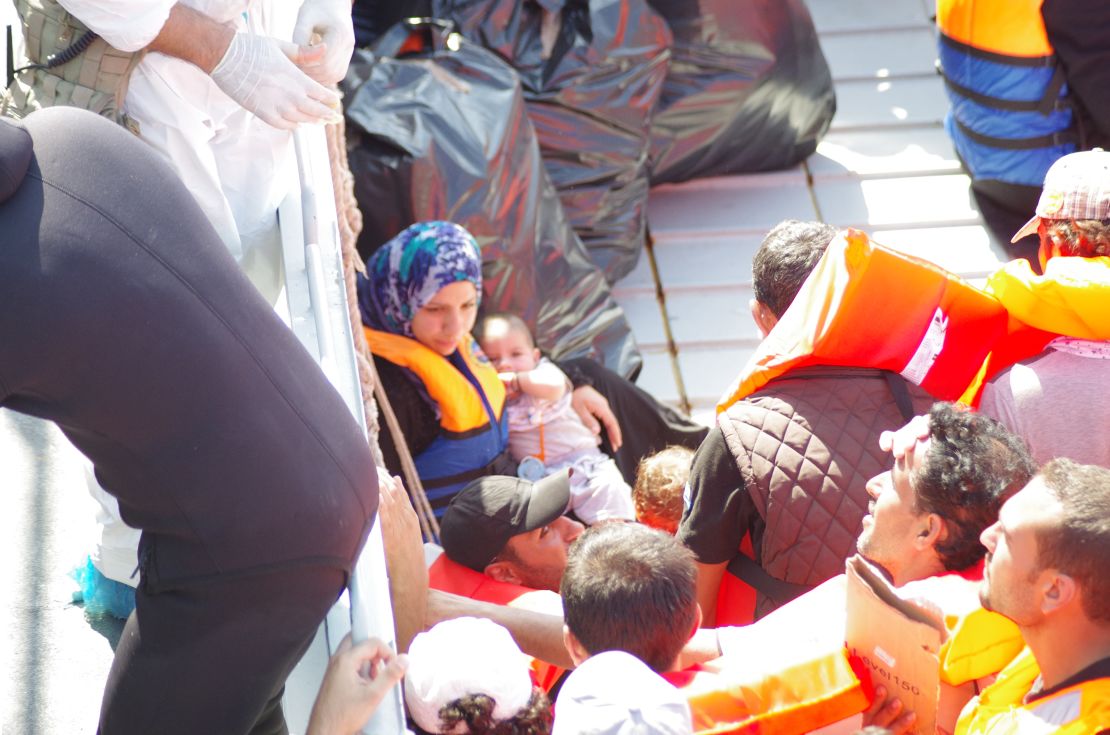 Refugees receive help from rescue boat "Phoenix."