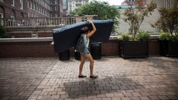 Emma Sulkowicz of Columbia University carries a mattress in protest of the university's lack of action after she reported being raped.