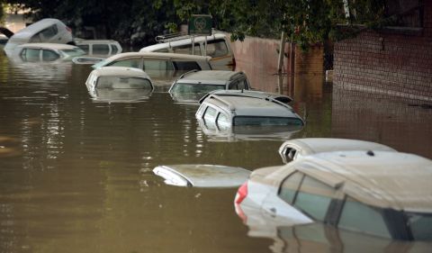 Submerged cars are seen on a flooded street in Srinagar on Thursday, September 11. 