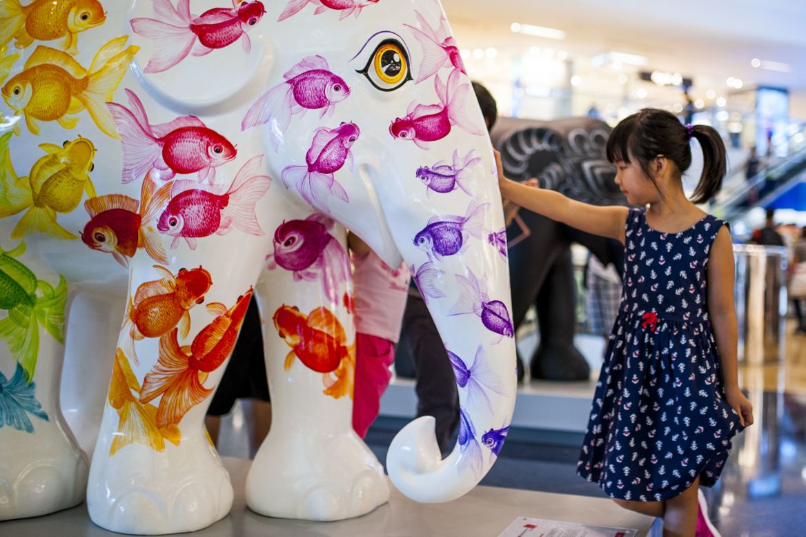 Artist Noppawan Nusansiri designed this colorful elephant to represent fish, a symbol that denotes positive feng shui in Asia. The statue is part of the "Elephant Parade" exhibit currently on display around Hong Kong.