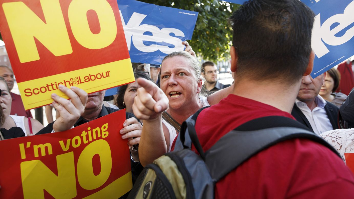 People campaigning for both sides of the independence referendum clash in Glasgow on Friday, September 12.