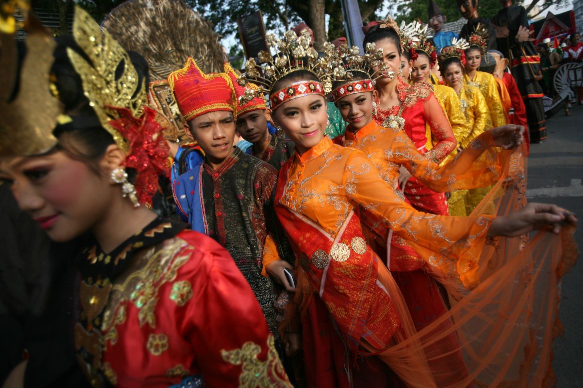 SEPTEMBER 12 - NORTH SUMATRA, INDONESIA: Student performers join an urban fashion show during a cultural parade in the city of Medan. 