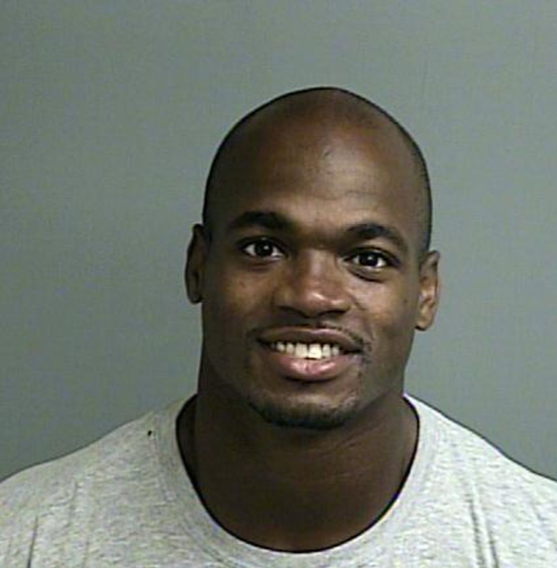 Adrian Peterson turned himself in early Saturday morning.