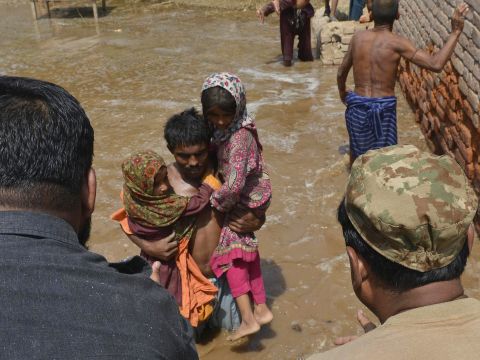 Pakistani soldiers rescue residents in Sher Shah on September 13.
