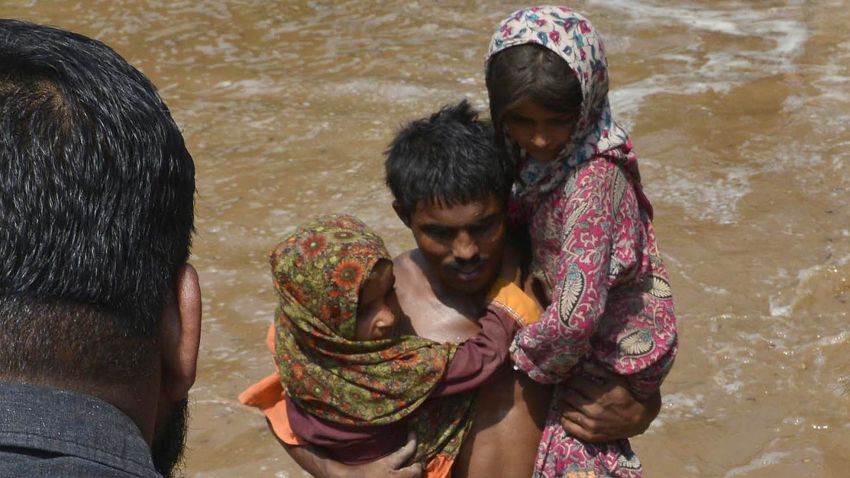 Residents affected by flooding are rescued by Pakistani Soldiers in Sher Shah, a town in Multan District in Punjab province of Pakistan, on September 13/