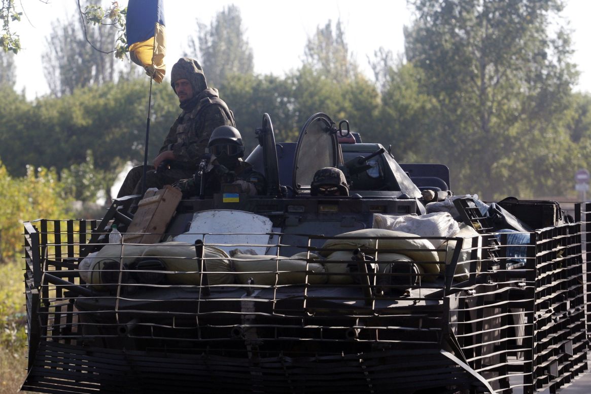 Ukrainian soldiers ride on an armored vehicle near Kramatorsk, Ukraine, on September 13.
