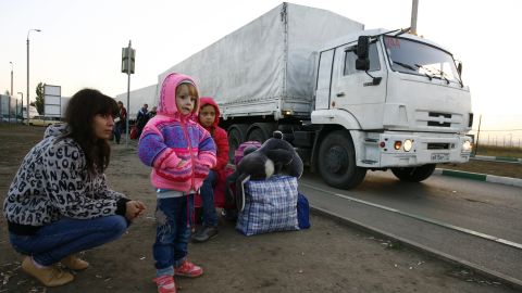Lorries, part of a Russian humanitarian convoy, cross the Ukrainian border on September 13.