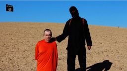 Alan Henning ispictured with an ISIS member in a frame taken from a video released by ISIS.