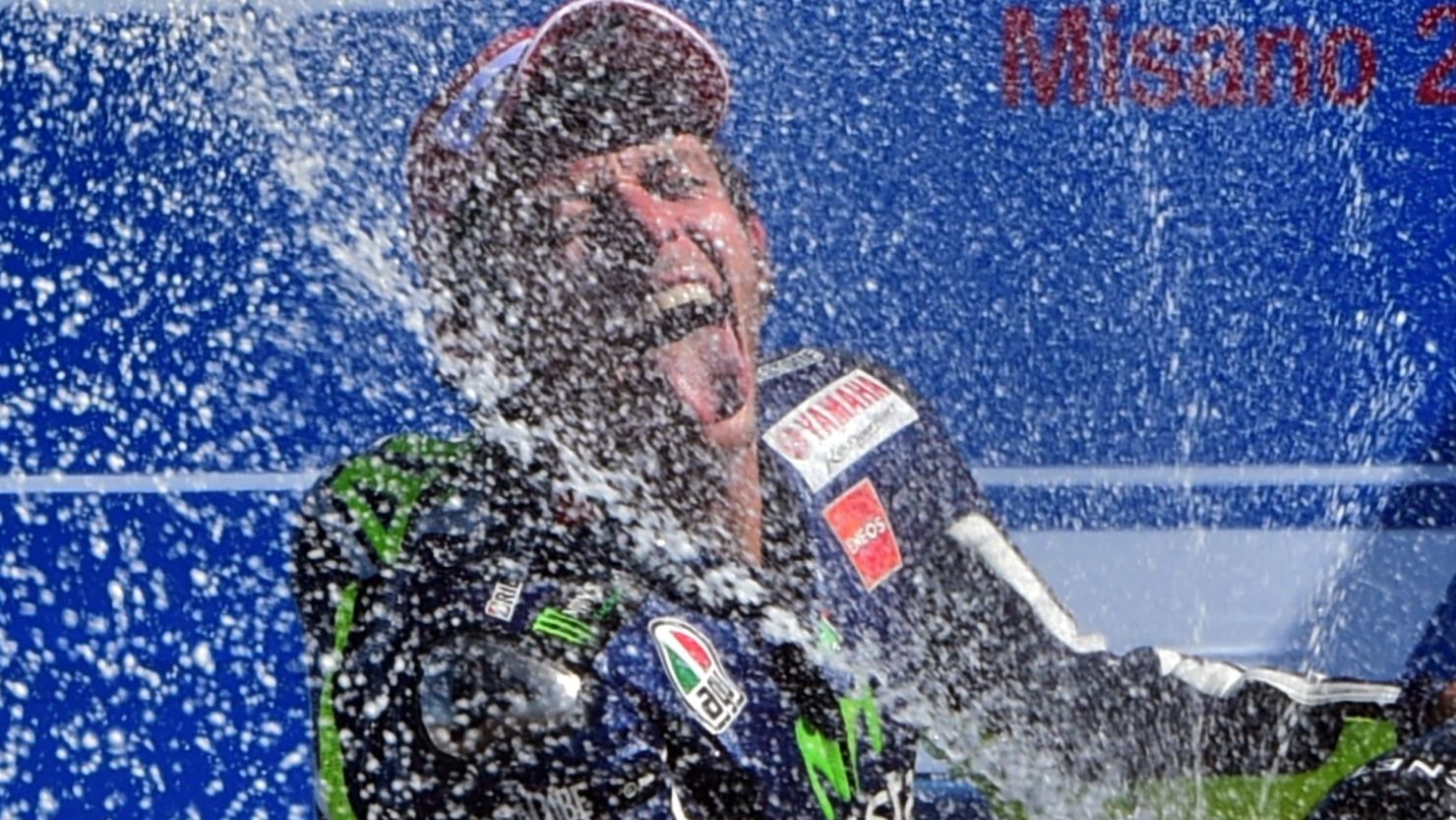 Valentino Rossi enjoys his champagne moment after claiming the San Marino MotoGP at Misano.