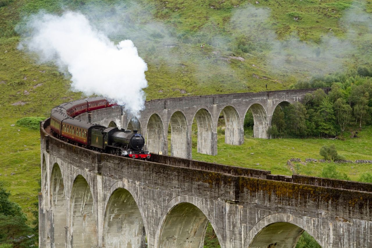 The Jacobite steam train (aka the Hogwarts Express) crosses the Glenfinnan Viaduct at the head of Loch Shiel. It's one of the most scenic railway routes anywhere.