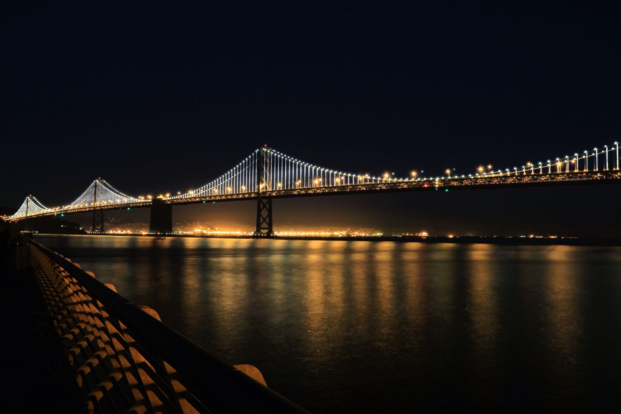 The San Francisco-Oakland Bay Bridge illuminates the San Francisco Bay in California. <a href="http://ireport.cnn.com/docs/DOC-1064986">Paul Heller</a>, who shot this photo in November 2013, described it as "a beautiful scene."