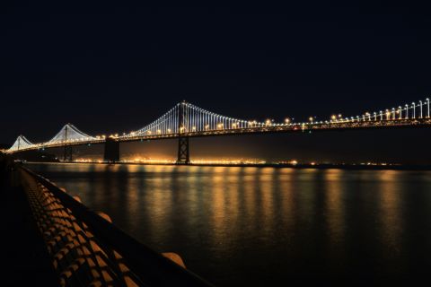 The San Francisco-Oakland Bay Bridge illuminates the San Francisco Bay in California. <a href="http://ireport.cnn.com/docs/DOC-1064986">Paul Heller</a>, who shot this photo in November 2013, described it as "a beautiful scene."