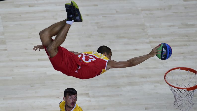 An acrobat performs at the FIBA World Cup before Serbia defeated France in a semifinal game Friday, September 12, in Madrid.
