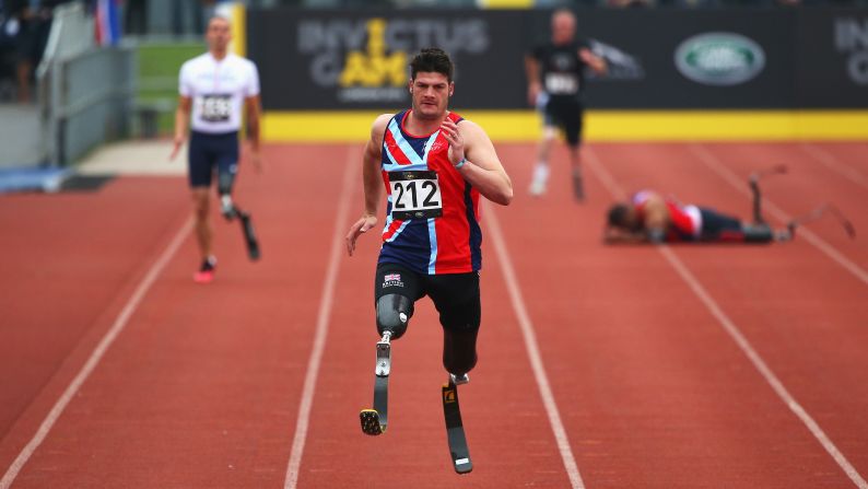 David Henson of Great Britain runs to victory in a 200-meter race Thursday, September 11, during the Invictus Games in London.