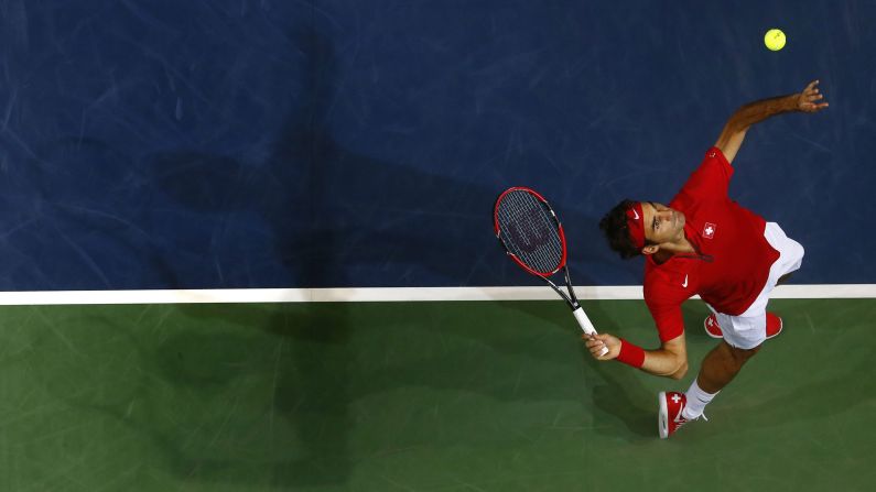 Roger Federer of Switzerland serves to Simone Bolelli of Italy during a Davis Cup match played Friday, September 12, in Geneva, Switzerland. Federer won the singles match in straight sets, and Switzerland would go on to advance to the Davis Cup final against France.