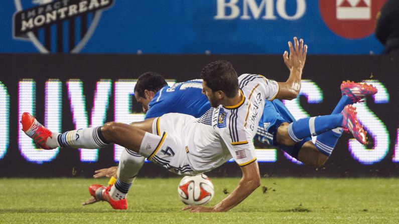 Los Angeles' Omar Gonzalez, front, collides with Montreal's Andres Romero during a Major League Soccer match Wednesday, September 10, in Montreal. The two teams played to a 2-2 draw.
