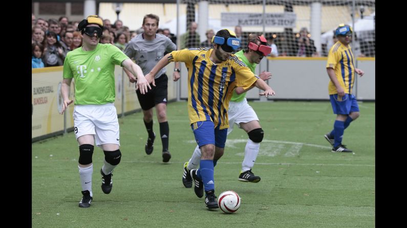 Players in Germany's blind soccer league compete in the final match of the season Saturday, September 13, in Lubeck, Germany. 