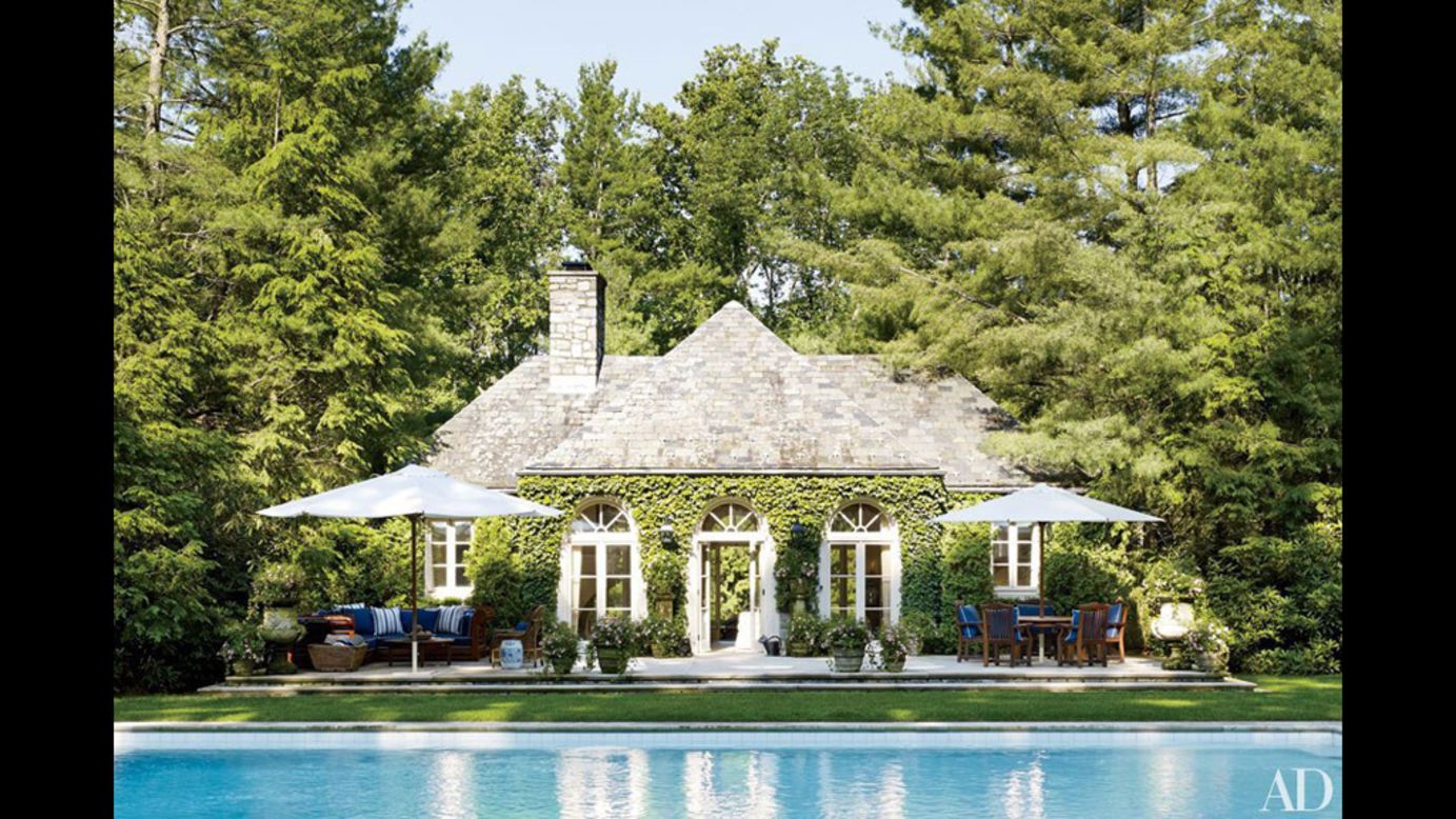 The poolhouse at Ricky and Ralph Lauren's Bedford, New York, estate is encircled by towering pines.