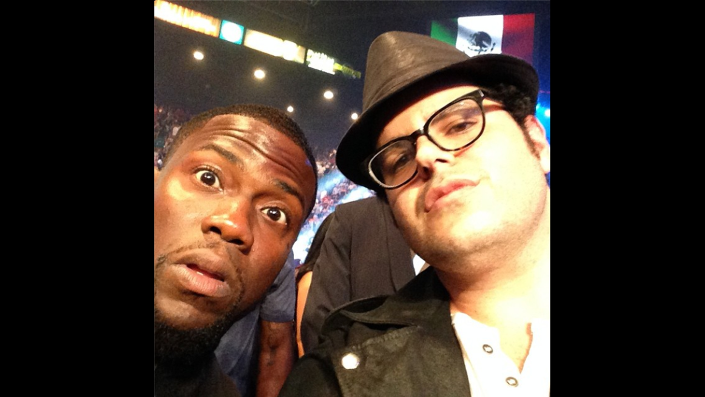 Comedian Kevin Hart, left, sits ringside with actor Josh Gad at the boxing event headlined by Floyd Mayweather on Saturday, September 13, in Las Vegas. "I treated him to this fight and he's blown away," <a href="http://instagram.com/p/s6zm0oCYpu/" target="_blank" target="_blank">wrote Hart,</a> who will appear with Gad in the upcoming movie "The Wedding Ringer."