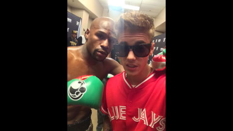Mayweather, posing for a selfie with Justin Bieber, has invested in Shot, a photo-sharing social media application. 