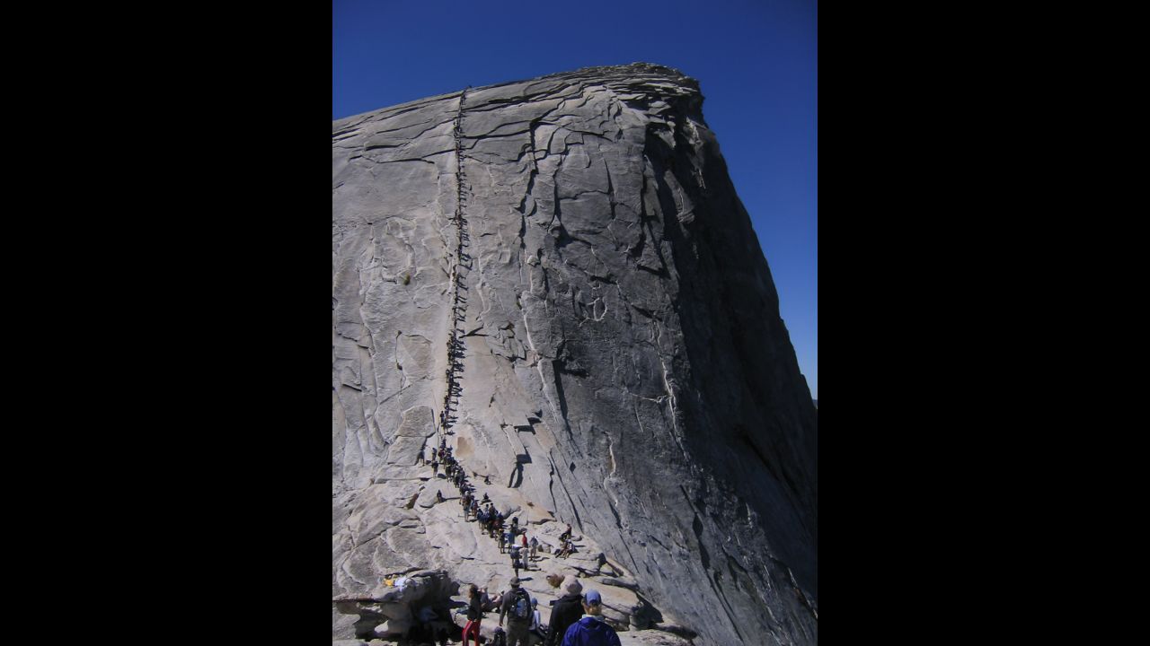 Yosemite's Half Dome in California has a stunning view--if you can get the permit and the strength to climb up the rock face along a cable ladder for more than 400 vertical feet.