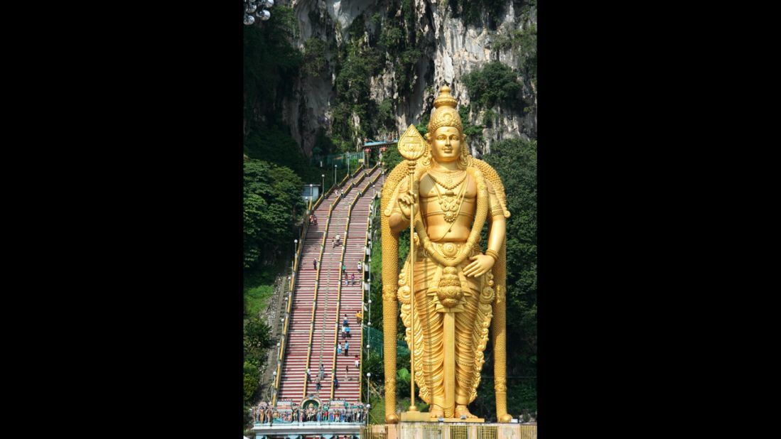 The highlight of at the Batu Caves of Malaysia is climbing the 272 steps leading 330 feet up the rock to the main Temple Cave--and making it past the macaque monkeys who might steal snacks and other things out of your bag.