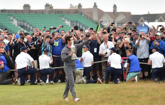 Spectators try to get a snap of McIlroy after his British Open win at Hoylake. Wifi was available throughout the course for the second year running and will be at the 2014 Ryder Cup in Scotland, with spectators encouraged to share their thoughts and pictures on social media.