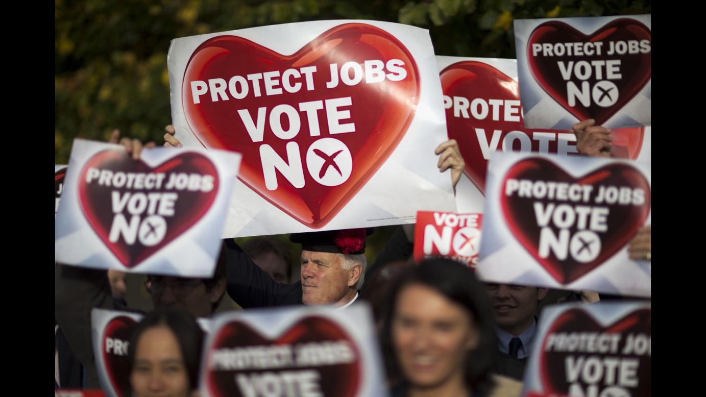 People hold "no" banners during a pro-union rally in Edinburgh on Tuesday, September 16.